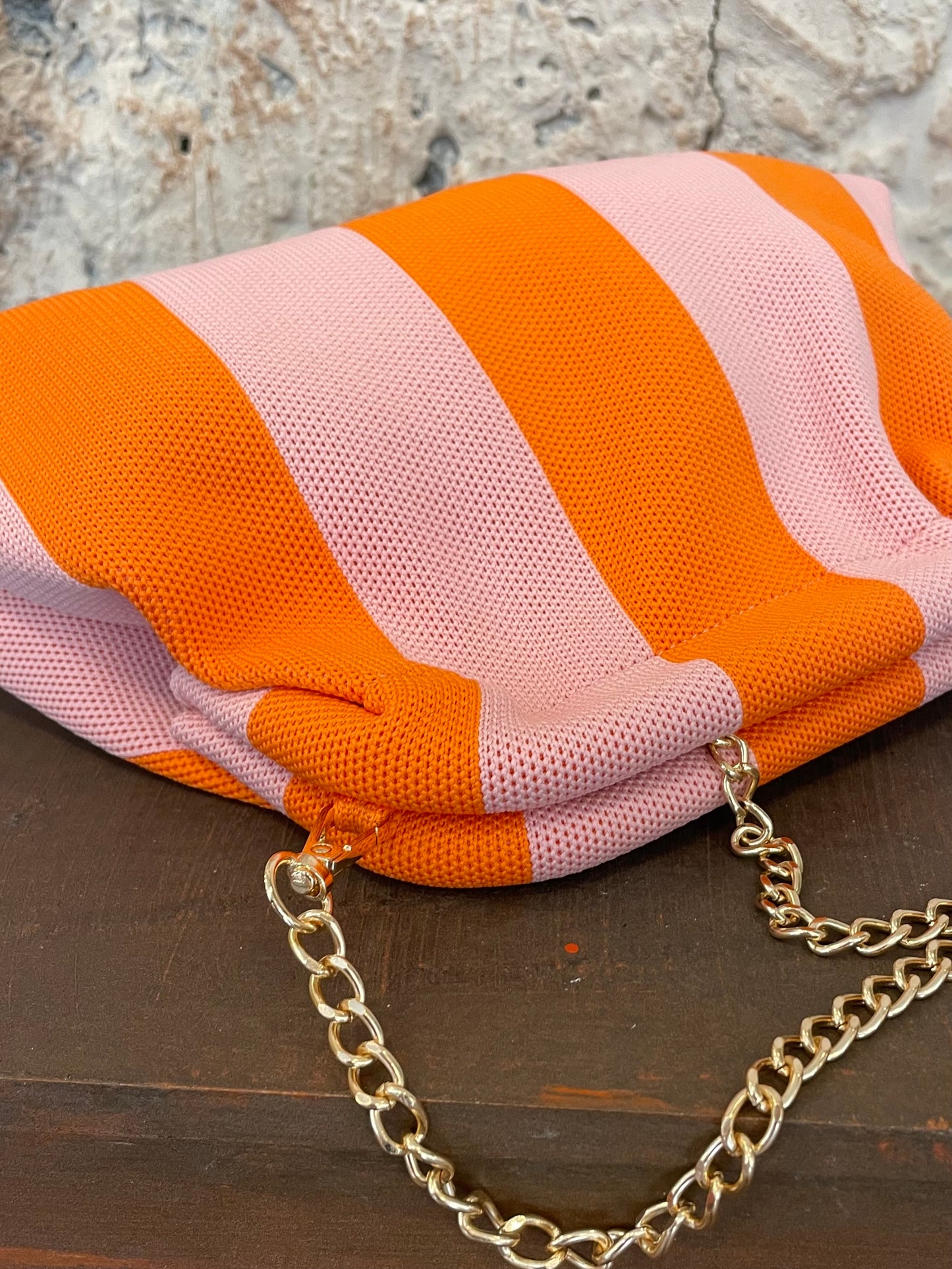 CLUTHC RAYAS ROSA - NARANJA