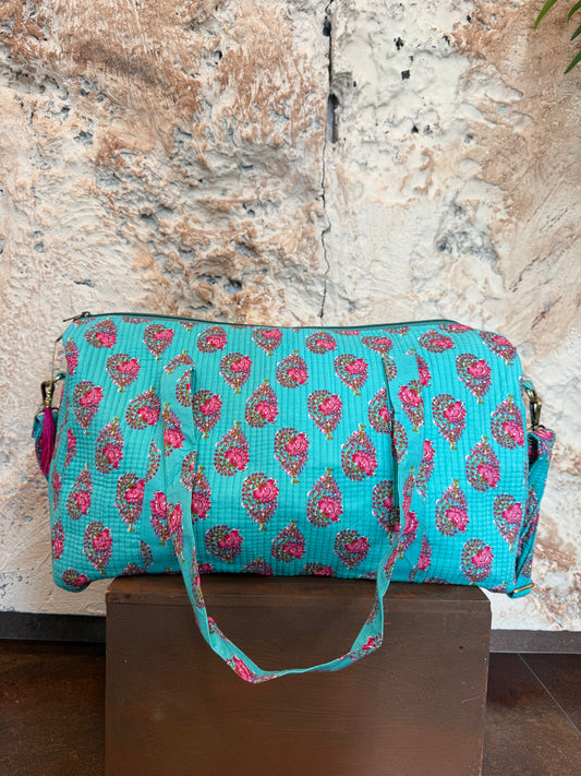 BOLSO VIAJE TURQUESA CON FLORES ROSAS